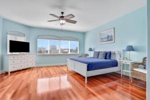 En eller flere senge i et værelse på Bayfront Bounty