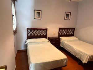 Posteľ alebo postele v izbe v ubytovaní Apartamento Edificio Cunchas