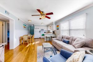 a living room with a couch and a ceiling fan at Bethany Meadows - 4E Briar N in Frankford