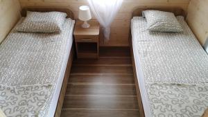 Posteľ alebo postele v izbe v ubytovaní Sielankowo Trzęsacz