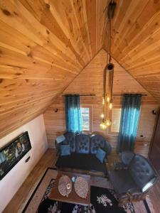 an overhead view of a living room in a log cabin at Cottage Mila in Žabljak
