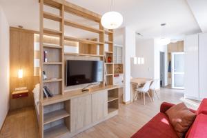 Televízia a/alebo spoločenská miestnosť v ubytovaní La Bella Centrum apartmanok Piros/Sárga