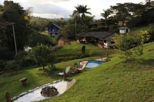 a yard with a swimming pool and a house at Casa del Rio in La Cumbre
