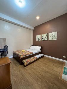 Postel nebo postele na pokoji v ubytování Excels Transient House in Baguio City