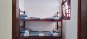 Ένα ή περισσότερα κρεβάτια σε δωμάτιο στο Apartamento em Cabo Frio com Wi-fi