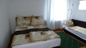 Postelja oz. postelje v sobi nastanitve Lemmerer Homestay