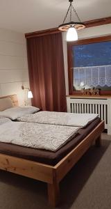 Postel nebo postele na pokoji v ubytování Ferienwohnung Schädler