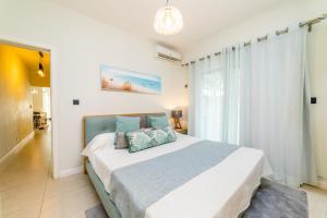 Voodi või voodid majutusasutuse Beachcove Apt No 1 toas