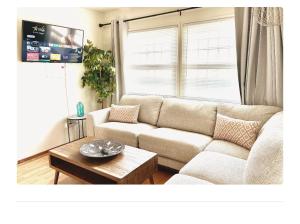 a living room with a couch and a table at Comfy & Cozy in LA Inglewood 5miles to LAX 4 minuts to Sofi stadium in Inglewood