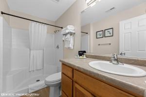a bathroom with a sink and a toilet at Beautiful Condo at the Springs By Cool Properties in Mesquite