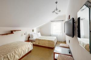 Letto o letti in una camera di Korona Hotel&SPA
