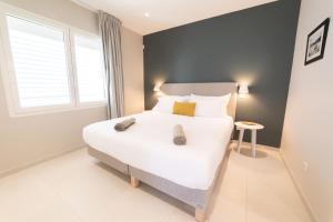 Postel nebo postele na pokoji v ubytování Eden Roc Appartements