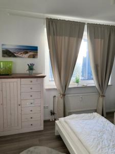 Postel nebo postele na pokoji v ubytování Küstenbude Sonne