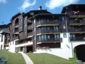 a building with balconies on the side of it at Appartement Morillon 1100, 2 pièces, 5 personnes - FR-1-642-31 in Morillon