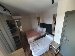 Ein Bett oder Betten in einem Zimmer der Unterkunft EUPHORIA ''Staying in Pleasure''