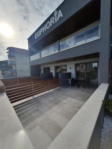 an external view of a building with a patio at EUPHORIA ''Staying in Pleasure'' in Paralia Katerinis
