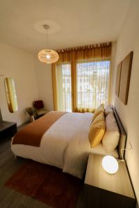 A bed or beds in a room at Valtellina Vacanze