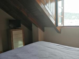 Posteľ alebo postele v izbe v ubytovaní Precioso triplex con jardín y Wifi Puig Falcó 1