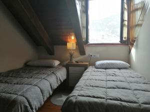 Posteľ alebo postele v izbe v ubytovaní Precioso triplex con jardín y Wifi Puig Falcó 1