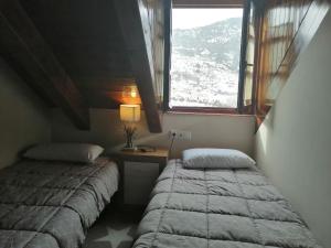 Posteľ alebo postele v izbe v ubytovaní Precioso triplex con jardín y Wifi Puig Falcó 1