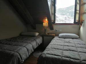 Posteľ alebo postele v izbe v ubytovaní Precioso triplex con jardín y Wifi Puig Falcó 1