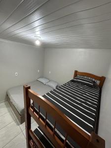 Cama o camas de una habitación en Apto Balneário Camboriú 4km praia central
