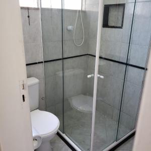 a bathroom with a shower with a toilet at Apartment Vitória Cabo Frio B in Cabo Frio