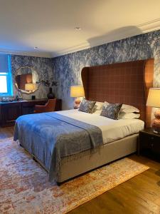 a bedroom with a large bed in a room at The Raeburn in Edinburgh