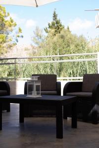 a table and two chairs on a patio with a view at Apartamento Catòlics 25 in Pollença