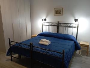 Postel nebo postele na pokoji v ubytování Casa vacanze Porta Garibaldi