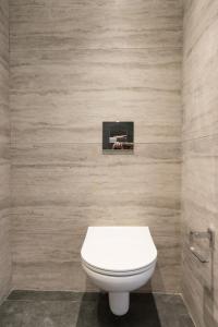 a bathroom with a white toilet in a room at Voda Luxury Residence #501 in Athens