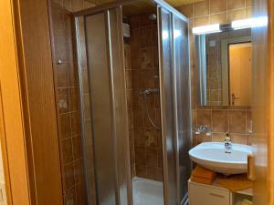 a bathroom with a shower and a sink at Ferienhaus Ferwall in Sankt Anton am Arlberg +21 photos