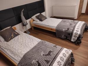 Postel nebo postele na pokoji v ubytování Dom Na Brzoskwiniowej