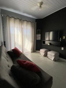 Cama o camas de una habitación en Mini Casa na praia!