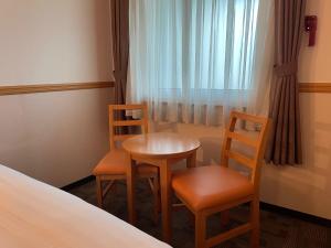 Postel nebo postele na pokoji v ubytování Toyoko Inn Busan Seomyeon