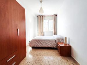 En eller flere senge i et værelse på Apartamento Diagonal Mar, cerca del Forum y la playa