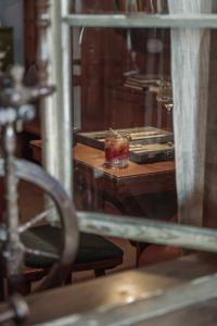 a reflection of a table with a candle on it at Gasthof Kohlern 1130 m in Bolzano