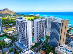 an aerial view of a city with tall buildings and the ocean at Aloha Hawaii, Waikiki Condo with Great Mountain Views & Free Parking! in Honolulu