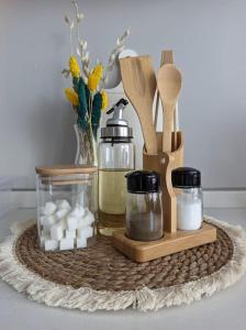 a tray with spices and other kitchen items on a table at Modern Apartment in the Heart of the City - Fatih in Istanbul