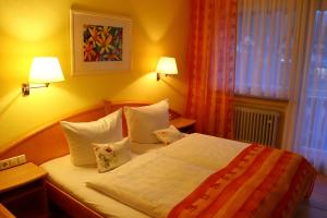 Postel nebo postele na pokoji v ubytování Haus Hubertus
