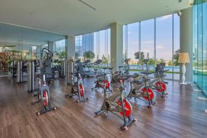 a gym with a bunch of cardio equipment in a building at Park Life Querétaro in Querétaro