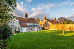 a view of a house with a yard at The Town House in Woodbridge