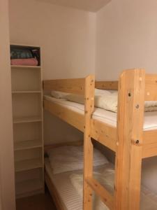 a room with two bunk beds in it at Apartmán Ramzová Kometa in Ostružná