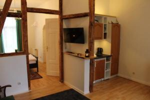 a room with a kitchen and a living room at Wiesengrund in Bad Harzburg