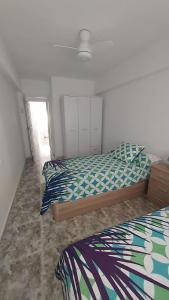 Postel nebo postele na pokoji v ubytování PISABEL