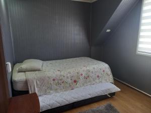 En eller flere senge i et værelse på Casa amplia y comoda en Puerto Montt