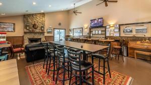 a restaurant with a table and chairs and a bar at Smoky Sunrise Getaway in Gatlinburg
