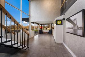 a hallway of a building with a view of a bridge at Essence Express Wayne in Wayne