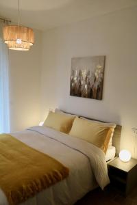 A bed or beds in a room at Valtellina Vacanze