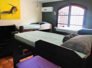 Cama o camas de una habitación en Hostel Guirlanda